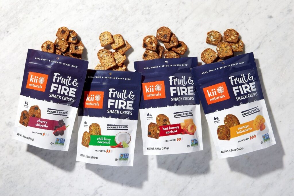 Packages of Fruit & Fire Snack Crisps on table.