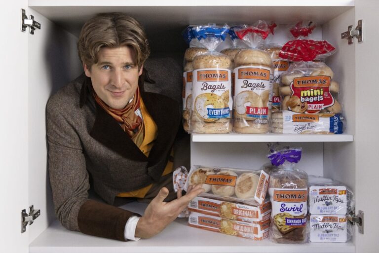 Brand character Thom in pantry with breakfast items.