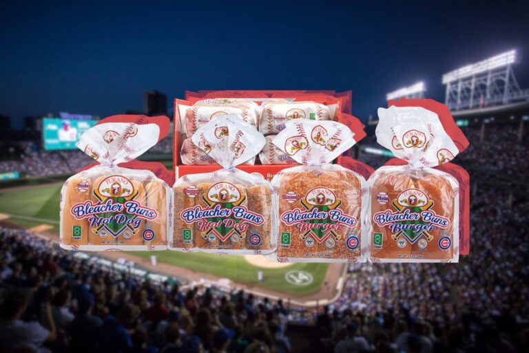 Turano Baking Company Hot dog and burger buns packages on blurred baseball field background.