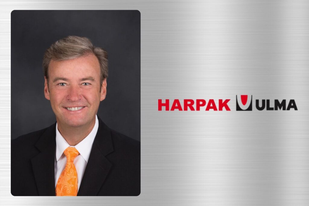 Kevin Roach, CEO of Harpak-Ulma, next to company logo on grey background