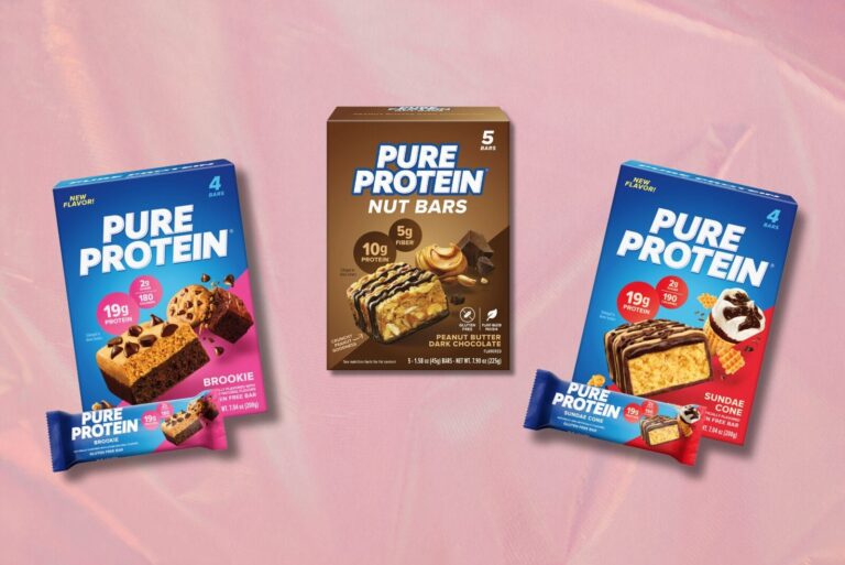 Boxed packages of Pure Protein bars on gradient pink background.