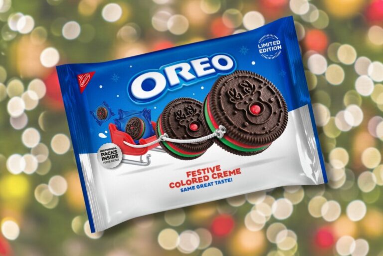 Package of festive OREOs on a Christmas-light themed background.