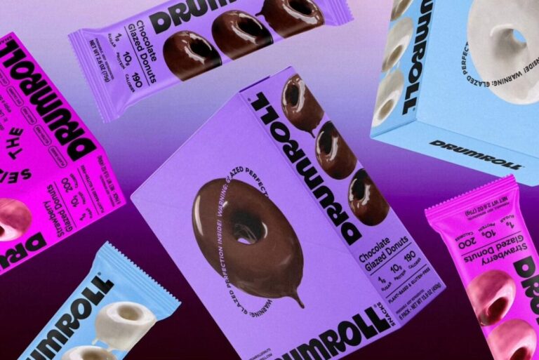 Pink, blue and purple packages of Drumroll donuts on gradient purple background