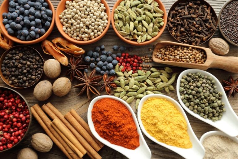 Groups of spices on table.