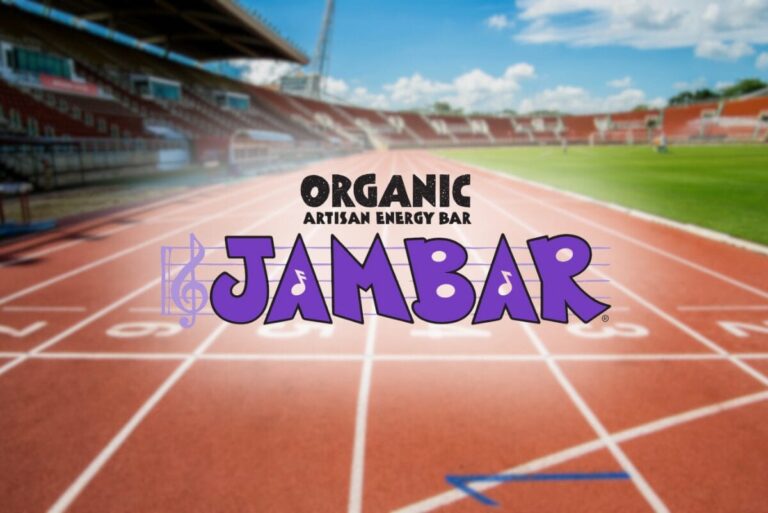 Jambar logo on blurred background of a track and field.