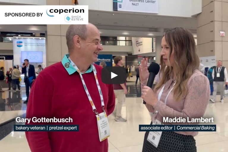 two people talking at a trade show