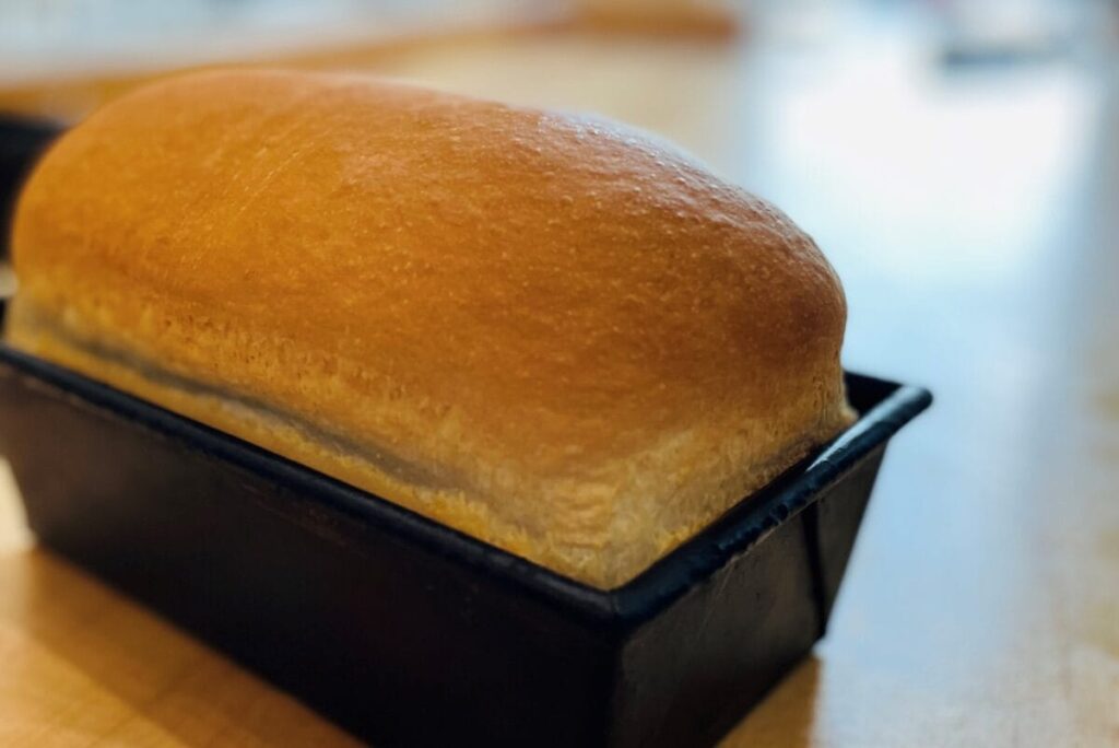 Loaf of bread in pan.