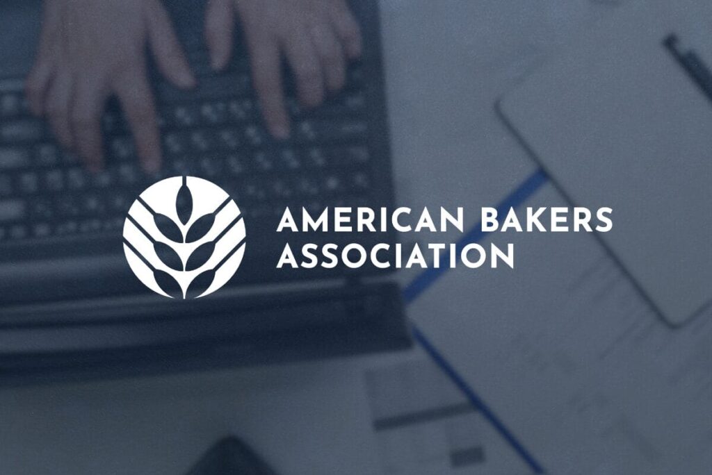 American Bakers Association logo over photo of overhead view of laptop and table