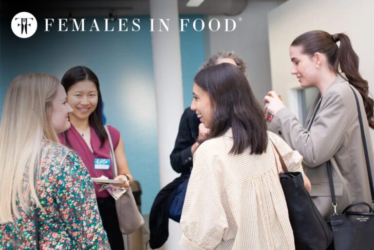 Females in Food logo with image from association event of women in professional attire networking