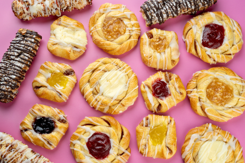 Assorted pastries from Strictly From Scratch on pink background