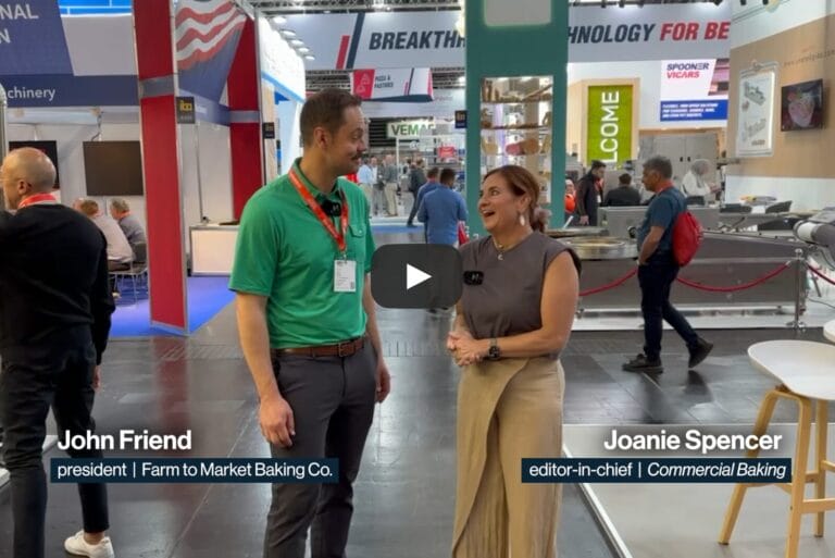 John Friend, president of Farm to Market Baking Co., at iba 2025 with Joanie Spencer, editor-in-chief of Commercial Baking