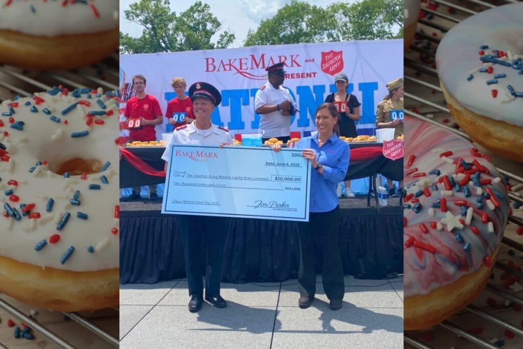 Image from BakeMark and Salvation Army National Donut Day 2025 with check featuring $10,000 donation to the Salvation Army National Capital Area Command