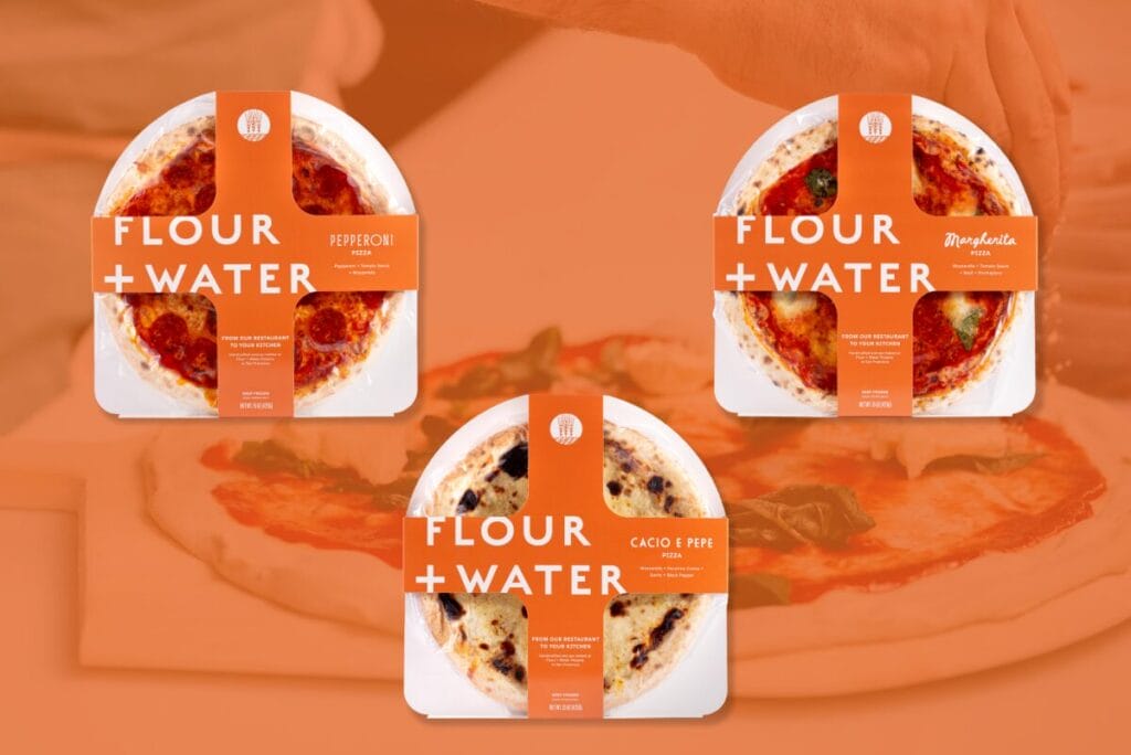 Flour + Water Foods frozen pizzas over orange background with pizza being made