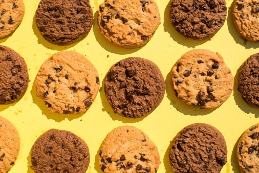 Rows of cookies on bright yellow background