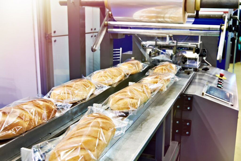 Bread being packaged in commercial bakery