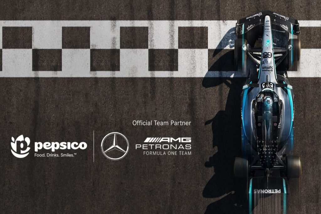PepsiCo and Mercedes-AMG Petronas Formula 1 logos over racetrack background