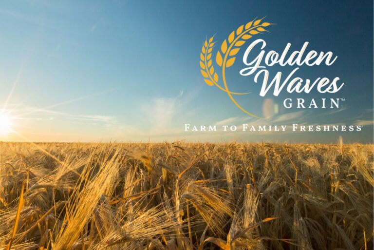 Golden Waves Grain logo over wheat field