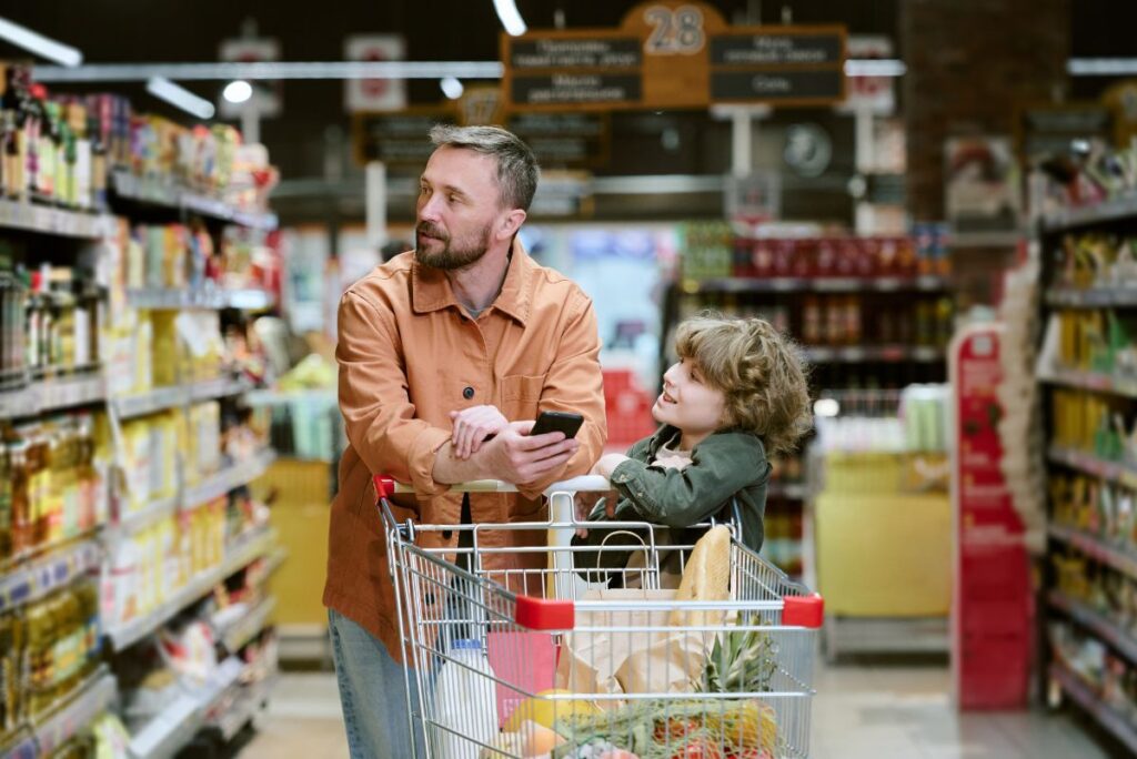 Father and son in a grocery store aisle