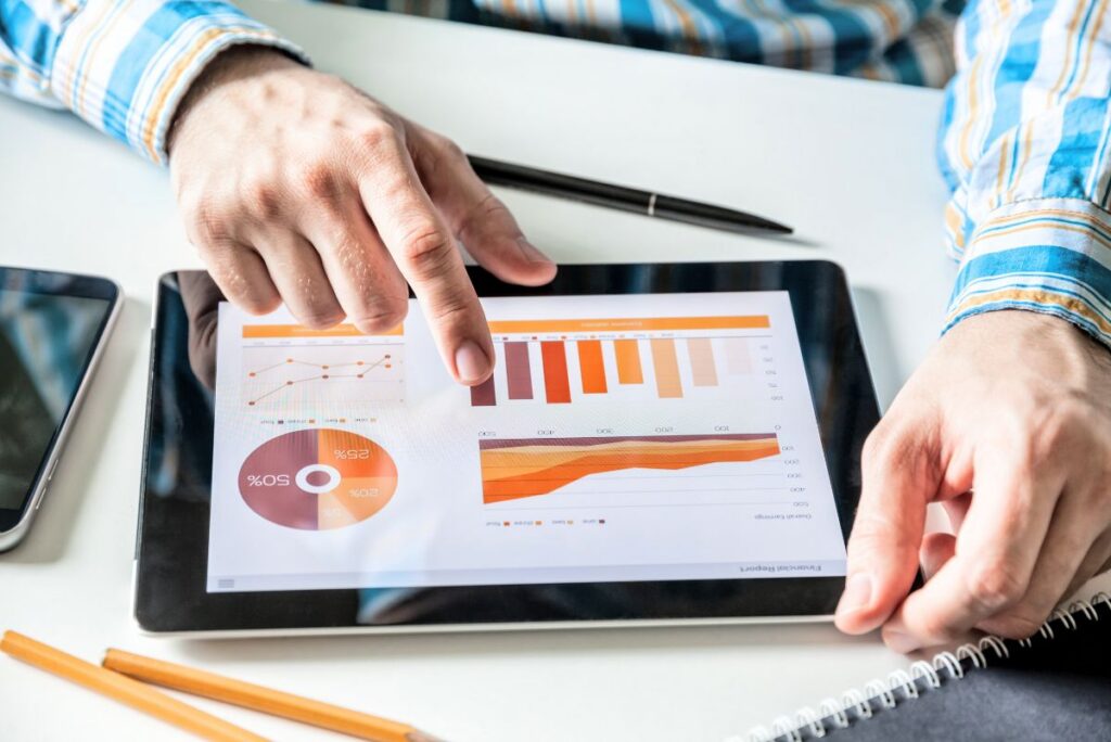 A man looking at data sheets for co-mans