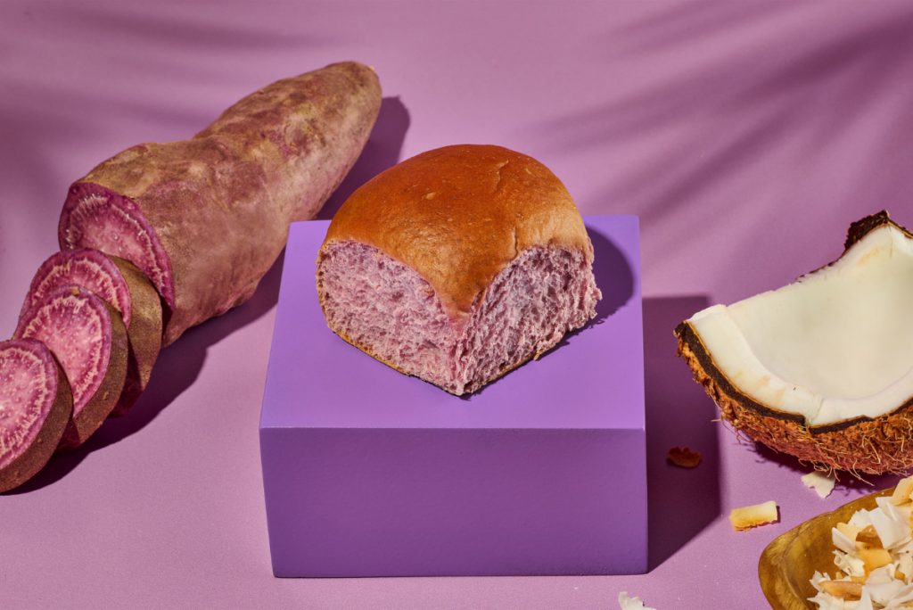 King's Hawaiian Ube Coconut Sweet Roll on purple box next to ube and coconut