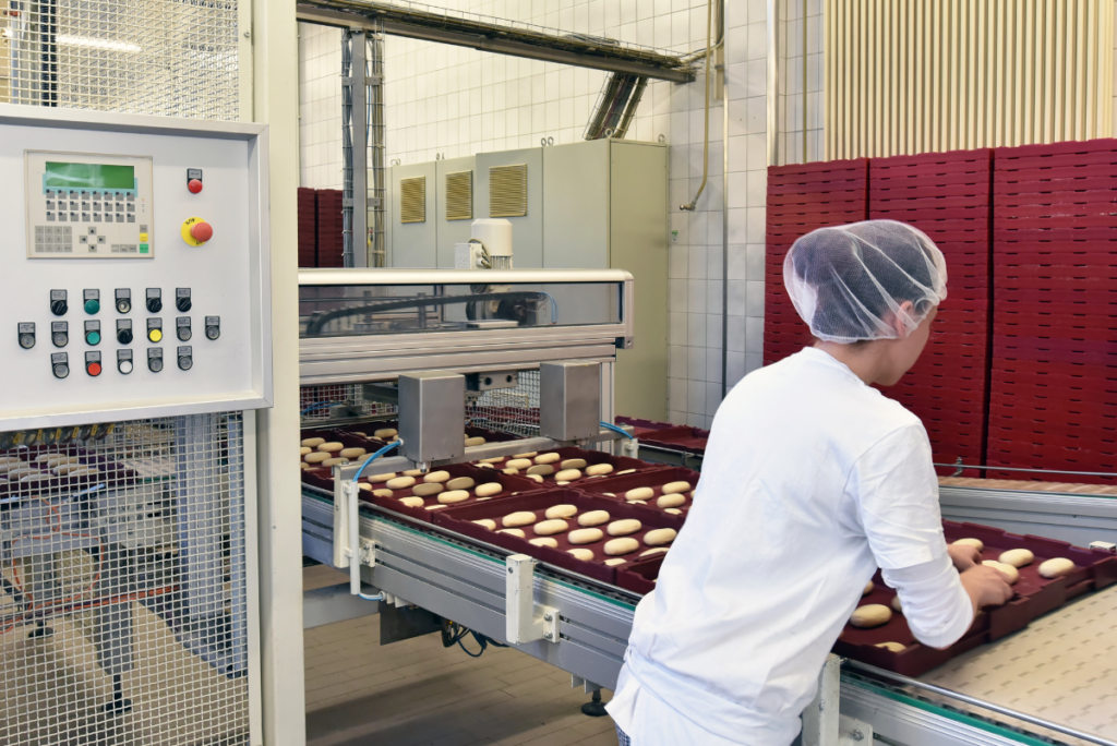 woman working on baked goods production line