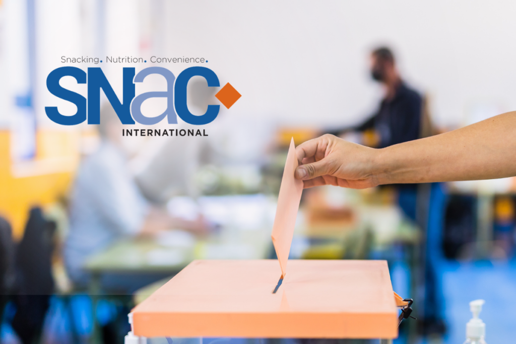SNAC International logo next to hand placing ballot in box