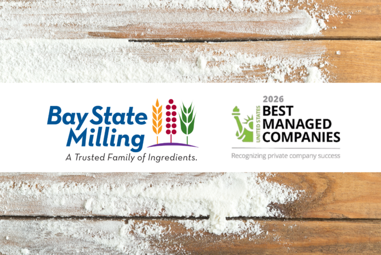 Bay State Milling Co. and Best Managed Companies logos over wooden boards with flour streaks