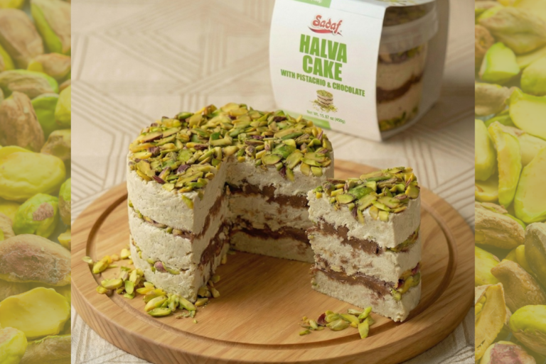 Sadaf Foods Halva Cake in Pistachio and Chocolate flavor on wooden serving dish