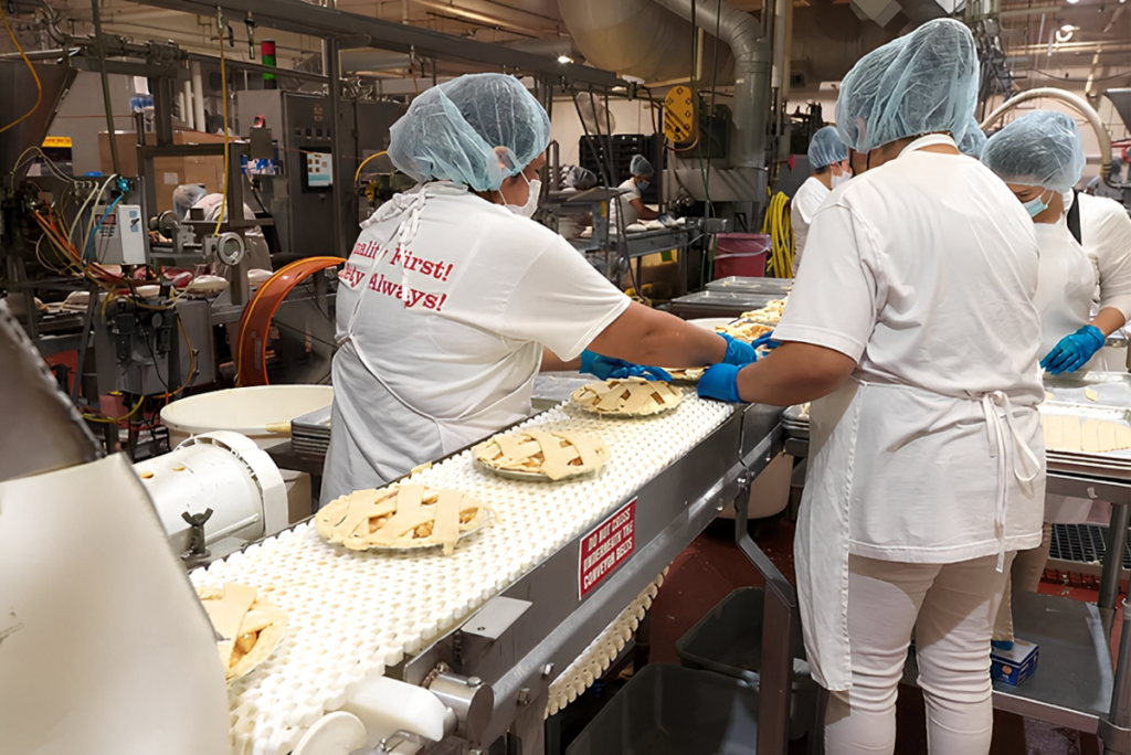 Workers making pies at Rocky Mountain Pies facility