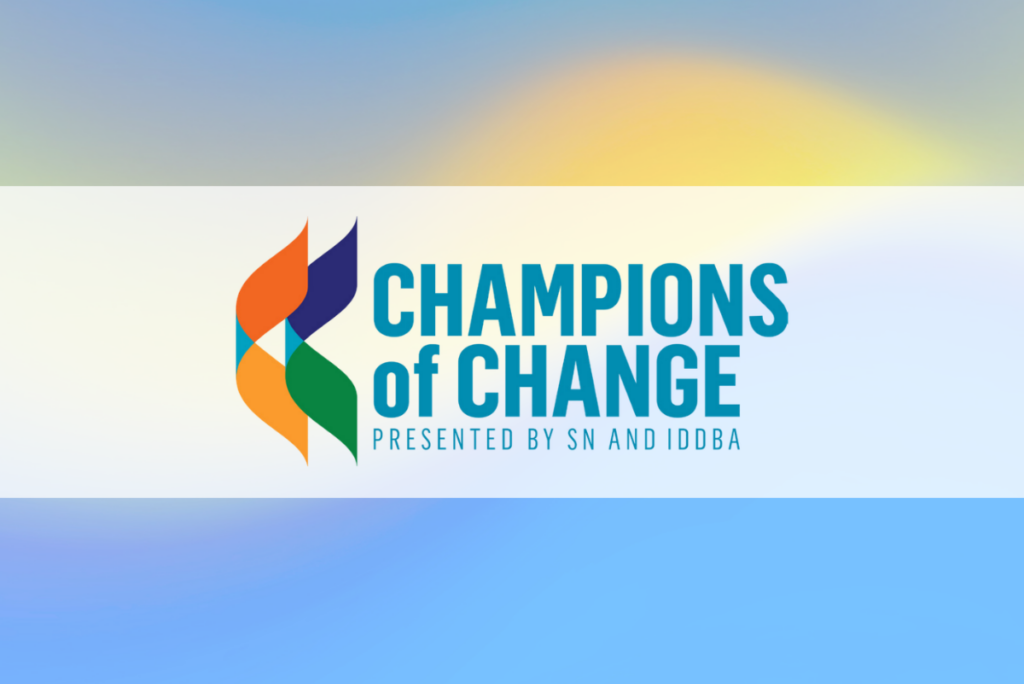 Champions of Change logo from IDDBA over blue and yellow gradient background