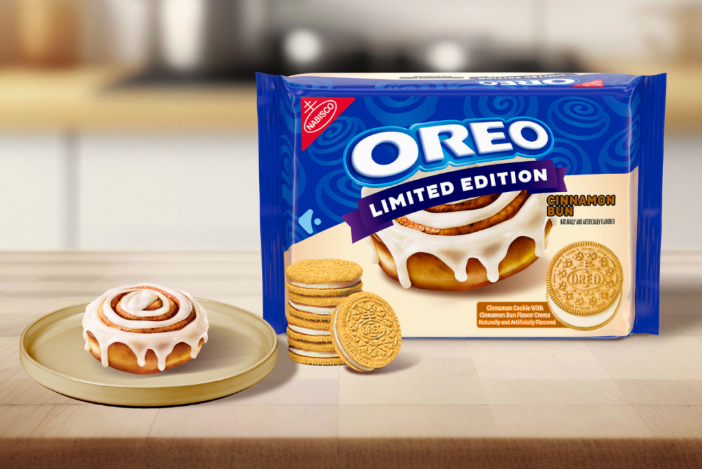 Lifestyle shot of a pack of OREO Cinnamon Bun Cookies next to a plate with a cinnamon bun