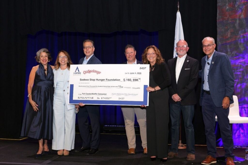 Aspire Bakeries team members presenting a record-breaking donation to stop hunger