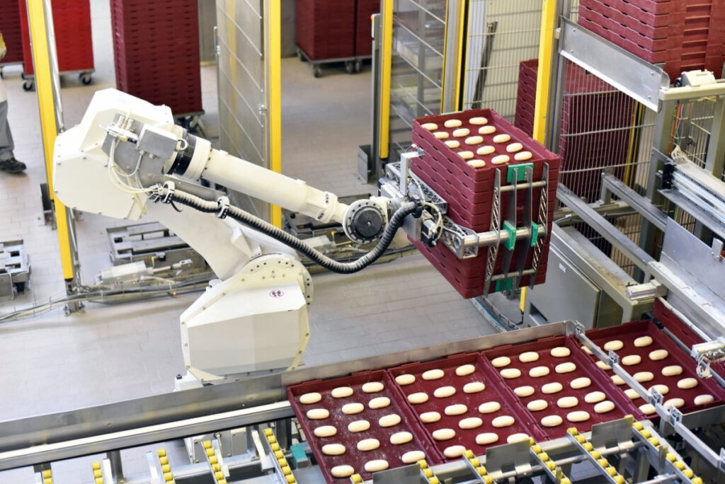 robotic arm moving baked goods